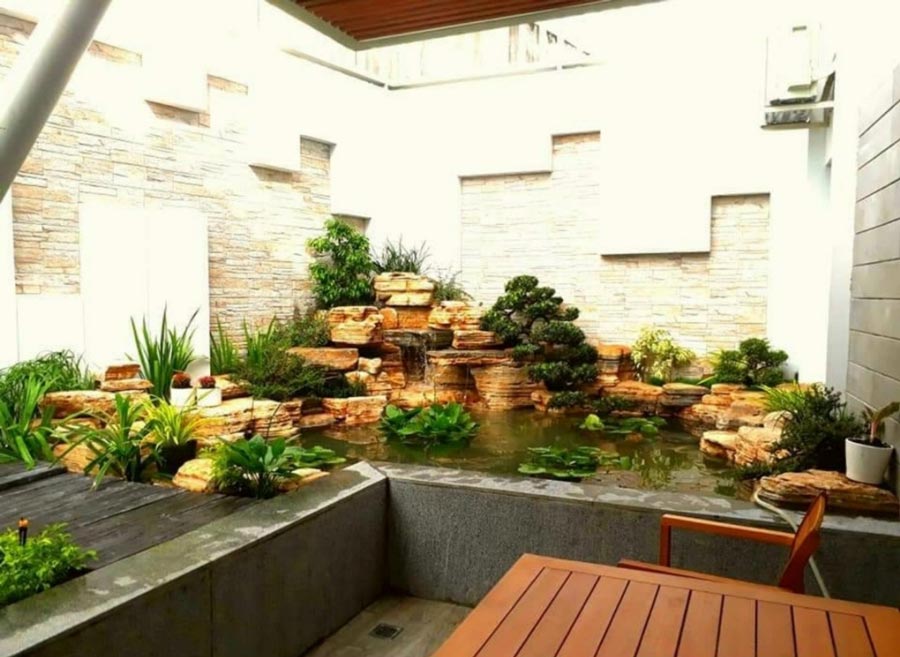 Tham khảo hình ảnh thi công hoàn thiện biệt thự sân vườn có ao cá